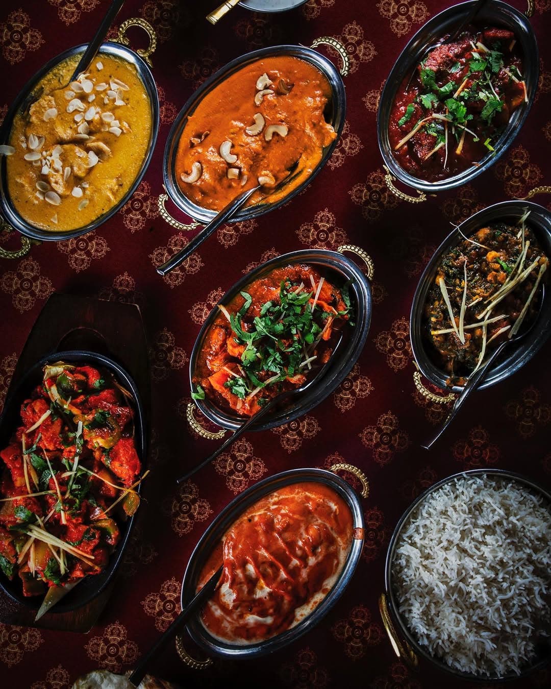 Chef preparing Nepalese cuisine at Ravintola Mantra kitchen